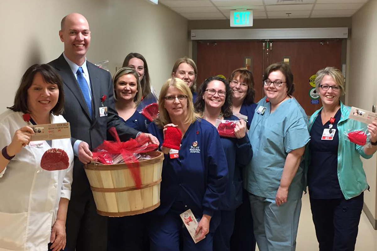 Porter Health Care System Staff Accept Little Red Hats for Newborns from the American Heart Association